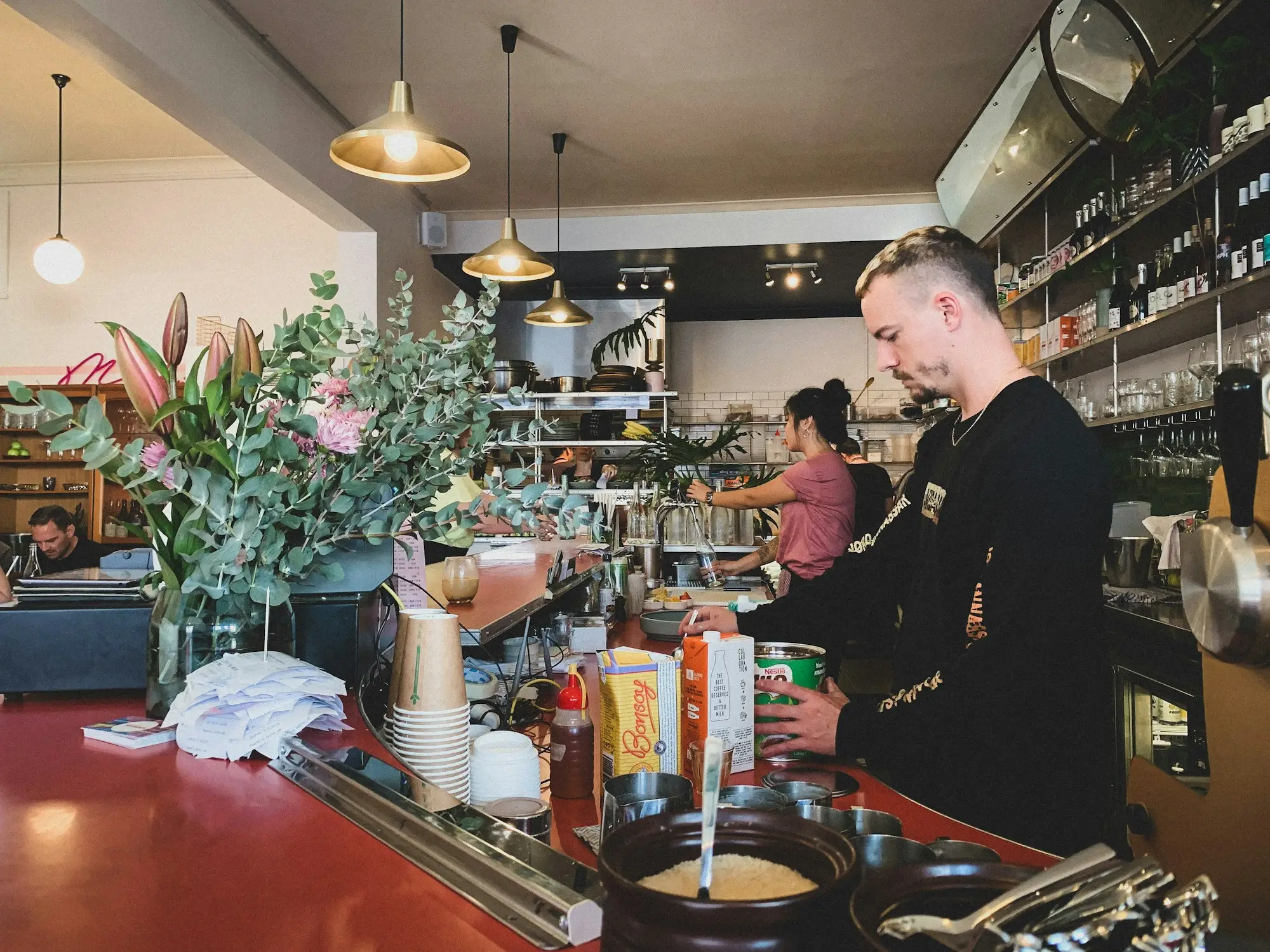 Café owner working behind the counter